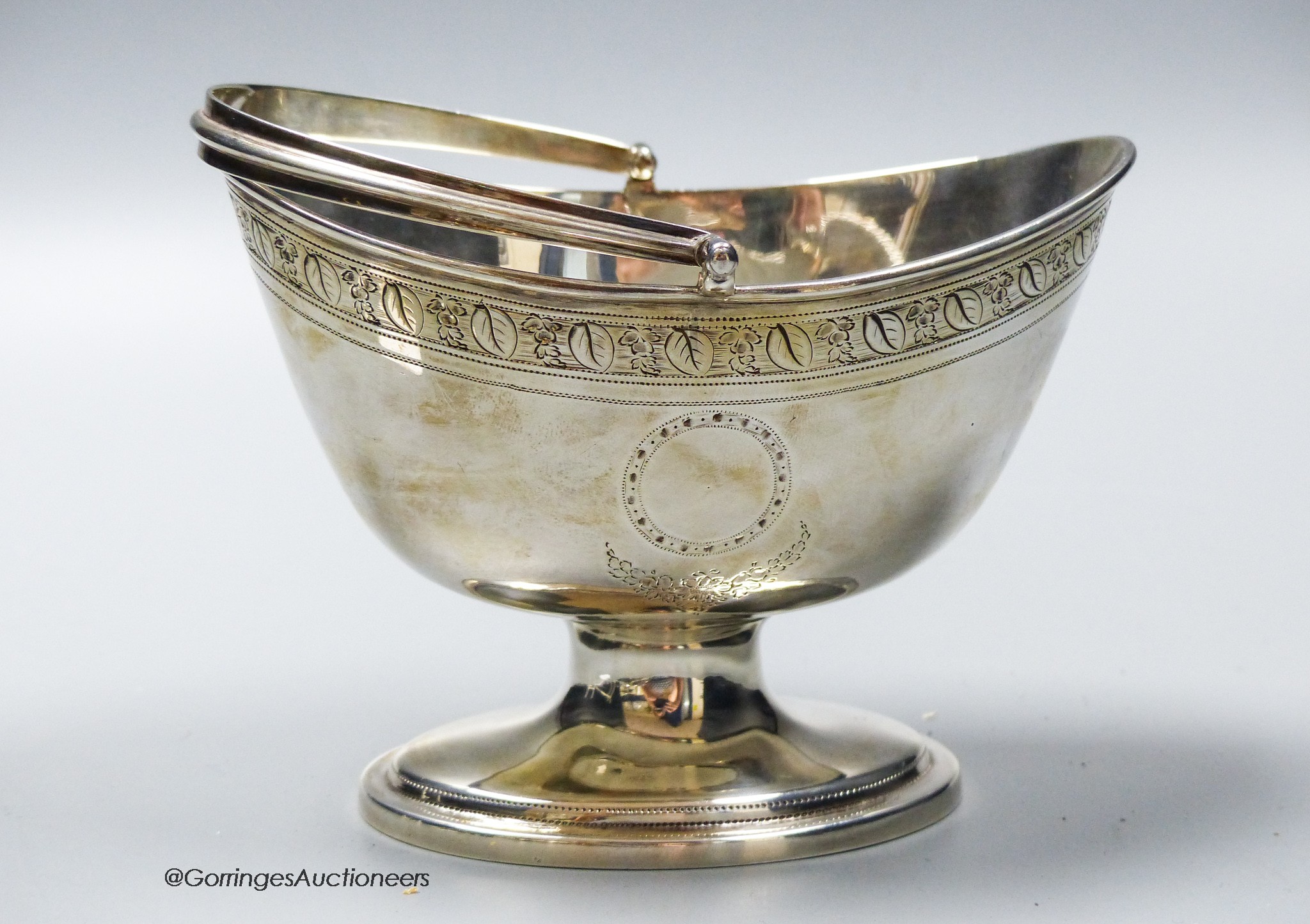 A George III engraved silver oval pedestal sugar basket, Charles Aldridge, London, 1797, length 13.8cm, 6oz.